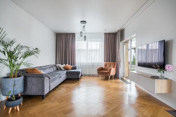 Modern living room with natural light and stylish furniture in a contemporary design