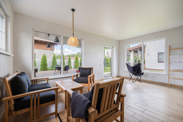 Cozy seating area with natural light and greenery in a modern home setting