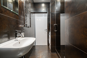 Modern bathroom design featuring sleek fixtures and stylish tiling in an urban setting