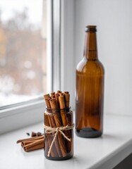 Cinnamon Sticks in Brown Jar next to Bottle against Window with Soft Lighting