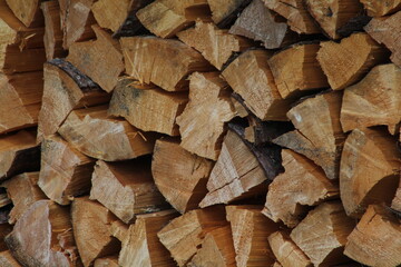Chopped stacked wooden logs textured abstract background wallpaper 