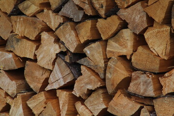 Chopped stacked wooden logs textured abstract background wallpaper 