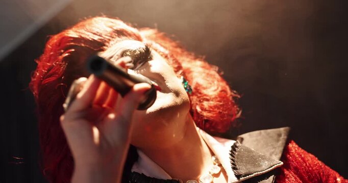 Stage, drag artist and person with microphone for performance, creative show and LGBTQ event. Singer, theater culture and performer with spotlight for singing, talent and musical entertainment