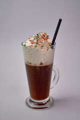 Indulge in a Decadent Dessert Beverage Featuring Rich Coffee Blended with Creamy Whipped Topping Topped with Colorful Sprinkles for a Delightful Treat