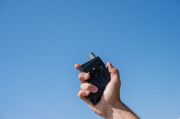 A man fires a flare gun with emergency fire. Close-up of a man's hand. 