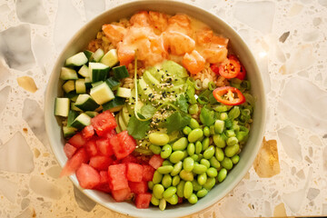 Colorful bowl of fresh vegetables and seafood with vibrant toppings and healthy ingredients