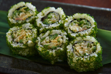 Deliciously Crafted Sushi Rolls Featuring Fresh Ingredients and Vibrant Green Toppings for an Exquisite Culinary Experience