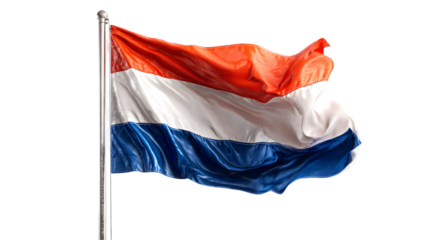 A dutch flag waving in the wind on a silver pole against a black background in a full shot view