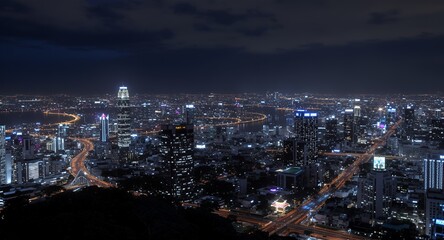 Obraz premium Night View of a Coastal City with Illuminated Skyscrapers and Highways