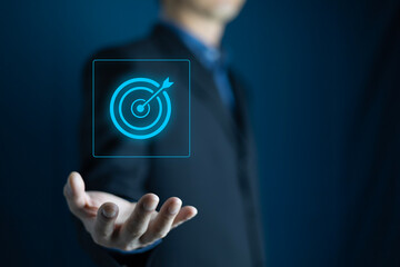 Business target concept, businessman holding target icon for business target