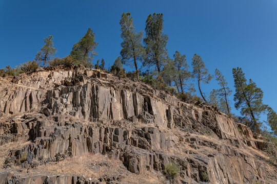 Greenstone of Bullion Mountain (Jurassic) --Chiefly andesitic and basaltic metatuff and metatuff breccia. California State Route 140, Midpines, Mariposa County. Metamorphic rock. Sierra Nevada
