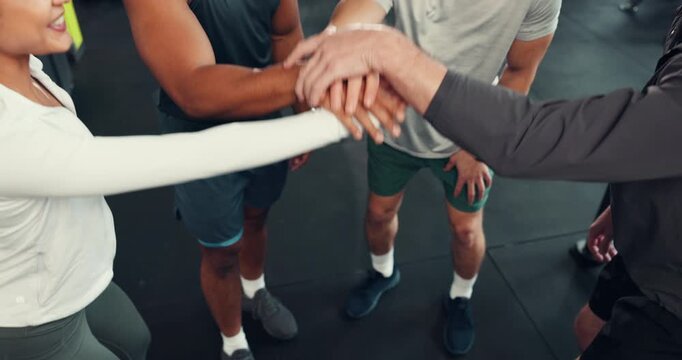 People, fitness or team with hands together above or applause for success or winning in gym. Top view, group or community clapping with pile or stack for huddle, achievement or mission in health club