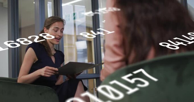 After interviewer asking question, interviewee reading folder and presenting business chart overlay