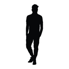 The silhouette of a man wearing a hat standing casually