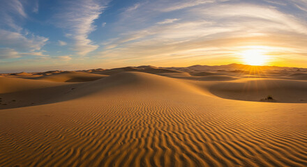 Golden sand dunes at sunset