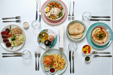 A Vibrant Array of Dishes Showcasing Diverse Flavors and Textures, Including Rice, Salads, Hummus,...