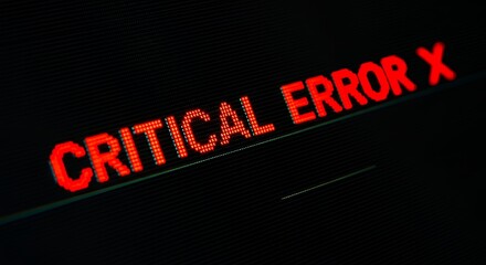 A red digital display shows the words "CRITICAL ERROR X" against a black background.