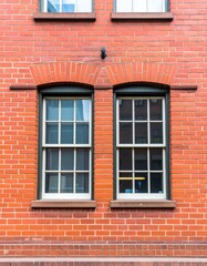 Brick building with two arched windows