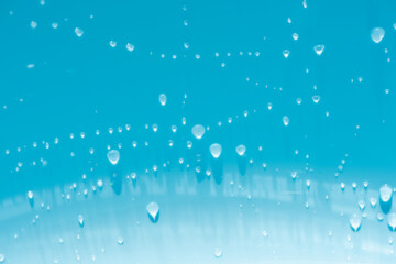 Blue water with ripples on the surface. Defocus blurred transparent blue colored clear calm water...