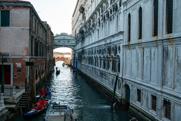 Wanddecoratie Brug der Zuchten Bridge of Sighs over a canal in Venice, Italy, with gondolas passing below  © HECTOR