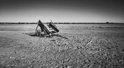 Abandoned cart on a barren desert landscape