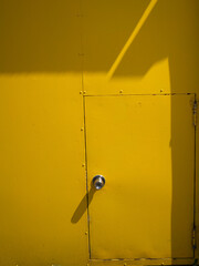 Yellow garage door on building facade