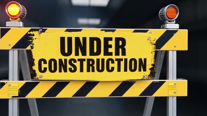 An image of an under construction sign with a yellow warning triangle and black caution symbol used for web page design or traffic safety - Powered by Adobe