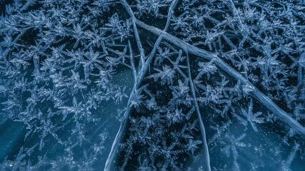 Frozen lake surface with intricate ice crystal formations - Powered by Adobe