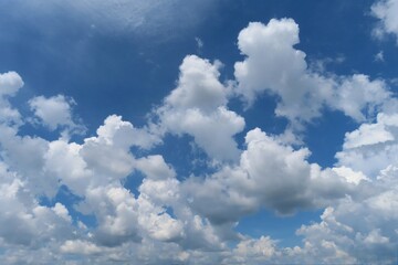 Beautiful shaped clouds in blue sky, natural cloudscape 
