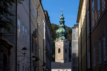 Tall clock tower of St Peter`s Abbey, is a Benedictine monastery and former cathedral in the Salzburg, Austria.