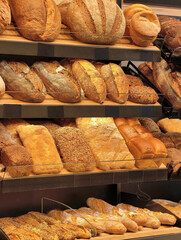 Delicious array of freshly baked bread displayed in a warm bakery setting on a bright morning