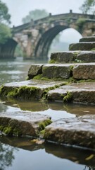 Moss-Covered Stone Steps Leading to an Ancient Arch Bridge Over a Calm River