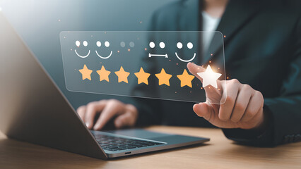 Customer satisfaction survey with star ratings and happy faces on a digital screen