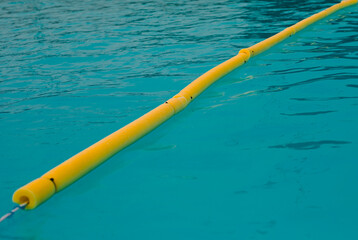 Naklejka premium Blue clear water in a filled swimming pool surface texture reflection