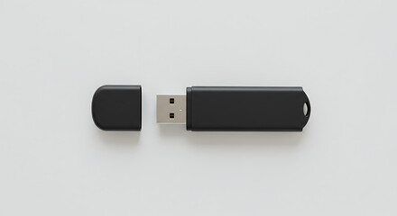 Top view of a blank black USB flash drive with the cap removed. A clean product mockup template for branding design.
