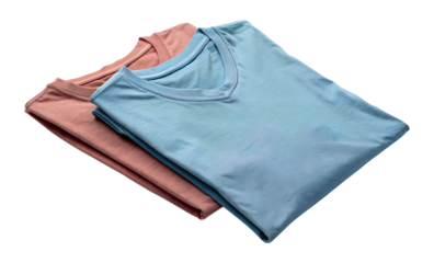 Two folded soft fabric t shirts one light blue and one peach colored isolated on transparent background