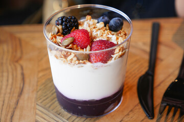 Healthy yogurt parfait featuring fresh berries and granola