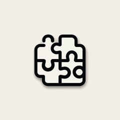 Fototapeta premium Interlocking Puzzle Pieces Icon with Black Stroke and Soft Shadow Effect