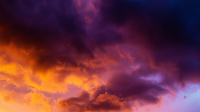 Dramatic sunrise with gradient orange and purple clouds, creating a panoramic abstract sky view. - Powered by Adobe