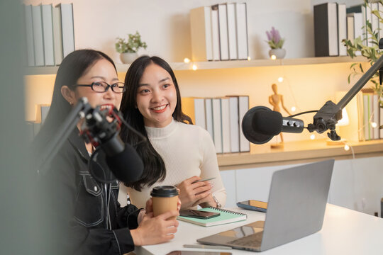 Friendly podcast hosts enjoying a creative discussion - Powered by Adobe