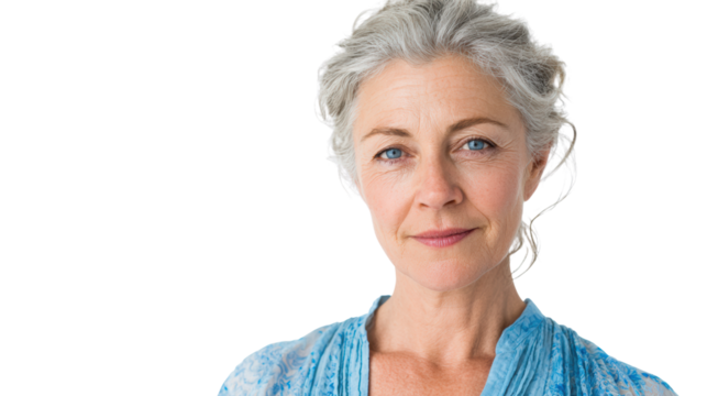 Confident mature woman with gray hair, wearing blue shirt, isolated on white background.