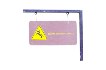 Sign warning BEWARE SLIPPERY SURFACE isolated on cut out PNG or transparent background. Brown wood sign with yellow letters Suspended from small steel beam structure. Safety of life and property.