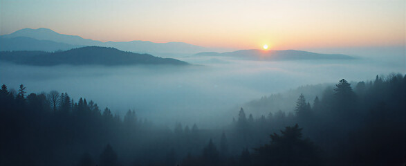 Fototapeta premium Misty landscape with distant mountains shrouded in thick fog, silhouetted trees on the foreground, dramatic chiaroscuro lighting from setting sun creating elongated shadows. Shot with wide angle lens 