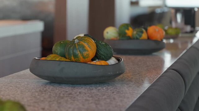 Close up, Bowls of mini squash pumpkins used for decorations in a restaurant for celebrating fall and Halloween.