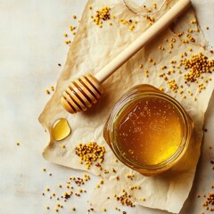 Fototapeta premium Honey in a jar, with honey dipper and mustard seeds, on parchment paper