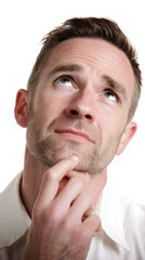 Obraz premium A man in a white shirt with his finger on his chin looking up with a thoughtful expression on his transparent background 