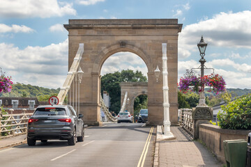 Cars traversing Marlow Suspension Bridge, Buckinghamshire, England