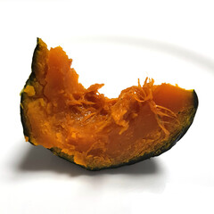  A series of images showing pieces of steamed pumpkin. The photos highlight the soft, flaky texture and the vibrant orange color of the pumpkin flesh. One of the images shows a hand holding a piece of