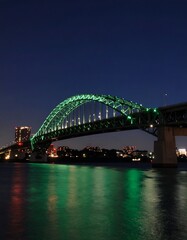 Naklejka premium Illuminated bridge at night