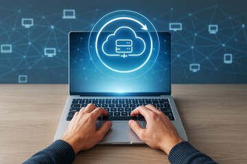 Person using laptop with cloud computing icon and data backup technology concept on digital network background in futuristic light style.